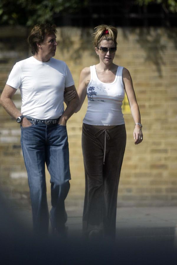 09/07/03  Paul McCartney and Pregnant Heather Mills take a walk near their London home today