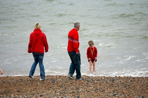 6th May 2006 Zoe Ball and Norman Coook with child at the Brighton Arts Festival on Brightonn Beach.