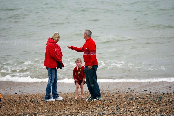 6th May 2006 Zoe Ball and Norman Coook with child at the Brighton Arts Festival on Brightonn Beach.