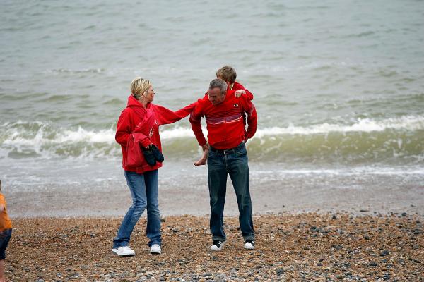 6th May 2006 Zoe Ball and Norman Coook with child at the Brighton Arts Festival on Brightonn Beach.