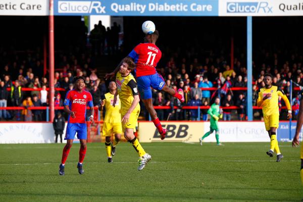 26/12/2016.  Aldershot Town v Woking FC. MENSAH climbs highest