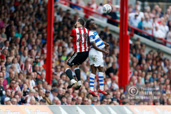 21/04/2018. Brentford v Queens Park Rangers SkyBet Championship Action from Griffin Park.  Brentford's Yoann BARBET & QPR’s Idrissa SYLLA battle