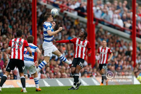 21/04/2018. Brentford v Queens Park Rangers SkyBet Championship Action from Griffin Park.  QPR’s Matt SMITH & Brentford's Romaine SAWYERS