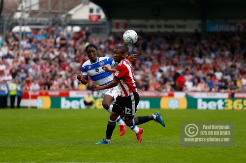 21/04/2018. Brentford v Queens Park Rangers SkyBet Championship Action from Griffin Park.  Brentford's Kamohelo MOKOTJO & QPR’s Osman KAKAY