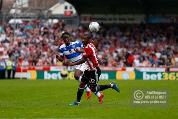 21/04/2018. Brentford v Queens Park Rangers SkyBet Championship Action from Griffin Park.  Brentford's Kamohelo MOKOTJO & QPR’s Osman KAKAY