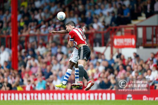 21/04/2018. Brentford v Queens Park Rangers SkyBet Championship Action from Griffin Park.  Brentford's John EGAN & QPR’s Idrissa SYLLA