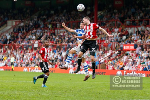 21/04/2018. Brentford v Queens Park Rangers SkyBet Championship Action from Griffin Park.  Brentford's Henrik DALSGAARD & QPR’s Massimo LUONGO