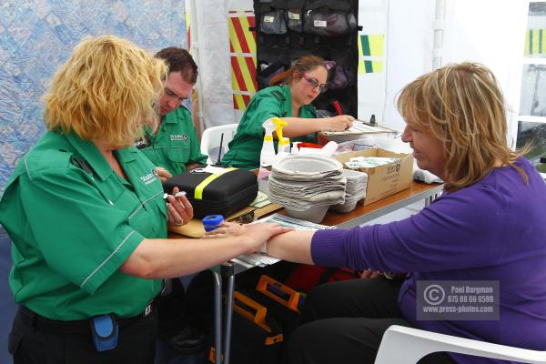 06/06/2015. Epsom Races. Dorking based St Johns Ambulance Volunteers at the Epsom Derby.

[Patient is actually the mum of one of the St Johns Ambulance team, and offered to be in the photos.]