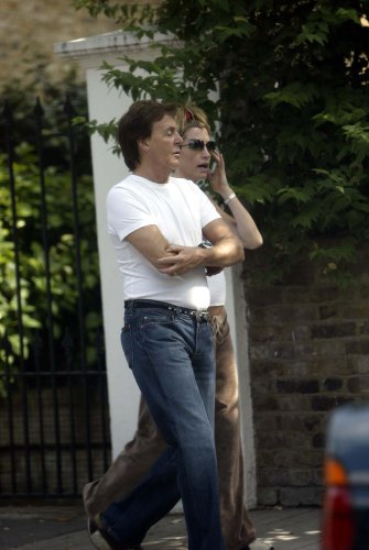 09/07/03  Paul McCartney and Pregnant Heather Mills take a walk near their London home today